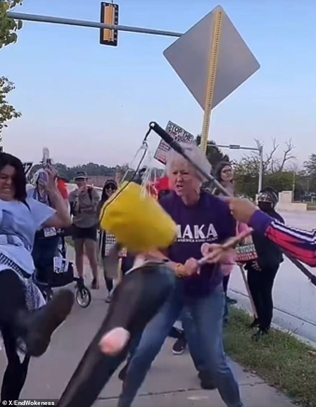 Kindness Shirts and Metal Pipes: Protester Smashes Trump Piñata