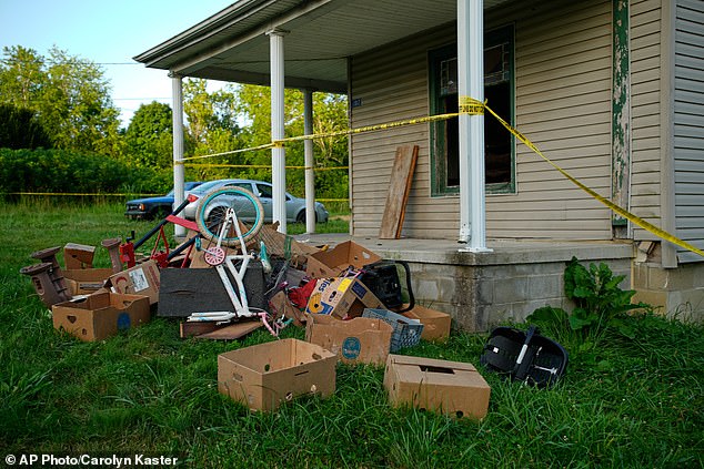 Ohio mother jailed after 16 children found living in filth inside garage-sized room.
