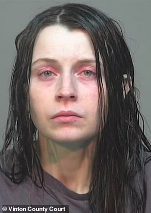 Ohio mother jailed after 16 children found living in filth inside garage-sized room.
